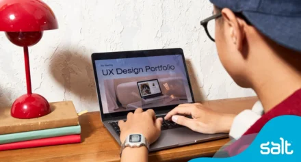 Man working on his UX Design portfolio on his laptop.