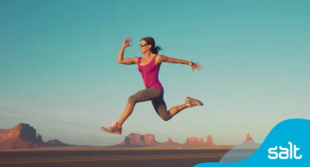 Woman running in a rough terrain.