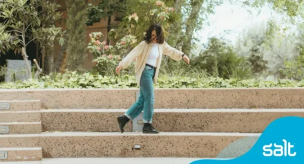 Woman dancing on stairs.