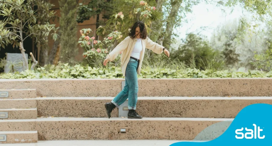 Salt ranked as a leading UK recruiter by FT and Statista 1 Woman dancing on stairs.