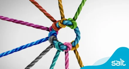 A colourful arrangement of ropes tied into a knot, symbolising connection and collaboration