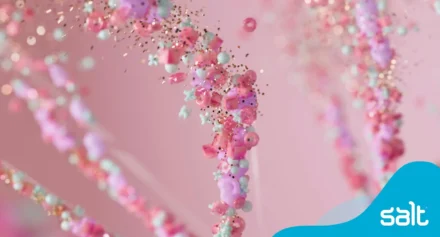 Abstract close-up of colourful bead-like shapes resembling a DNA strand, symbolising AI and data processing