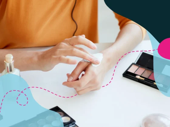 Close up of someone using beauty products on their hand.