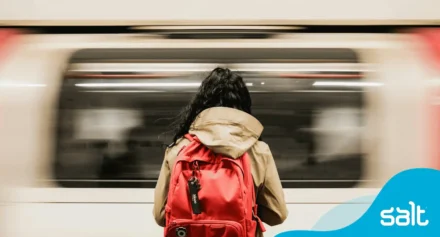 A person with a backpack on the underground