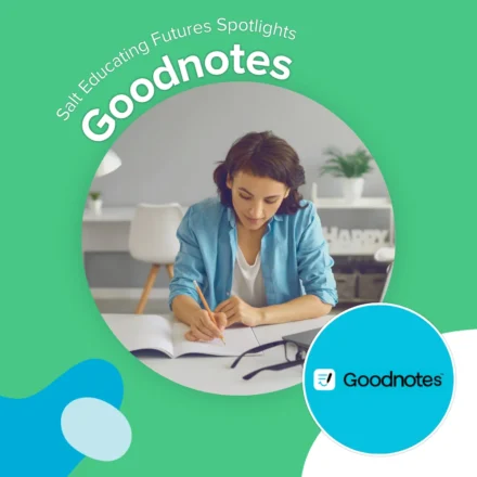 A woman at a desk making notes