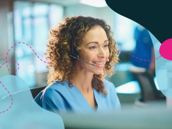 Woman at hospital help desk with a headset on