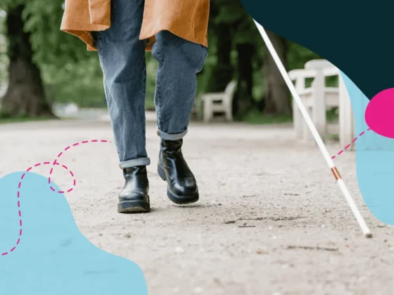 A person walking with a visual impairment stick