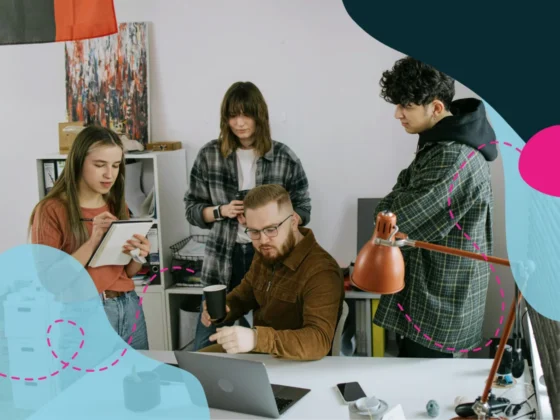 Team working at a desk together.