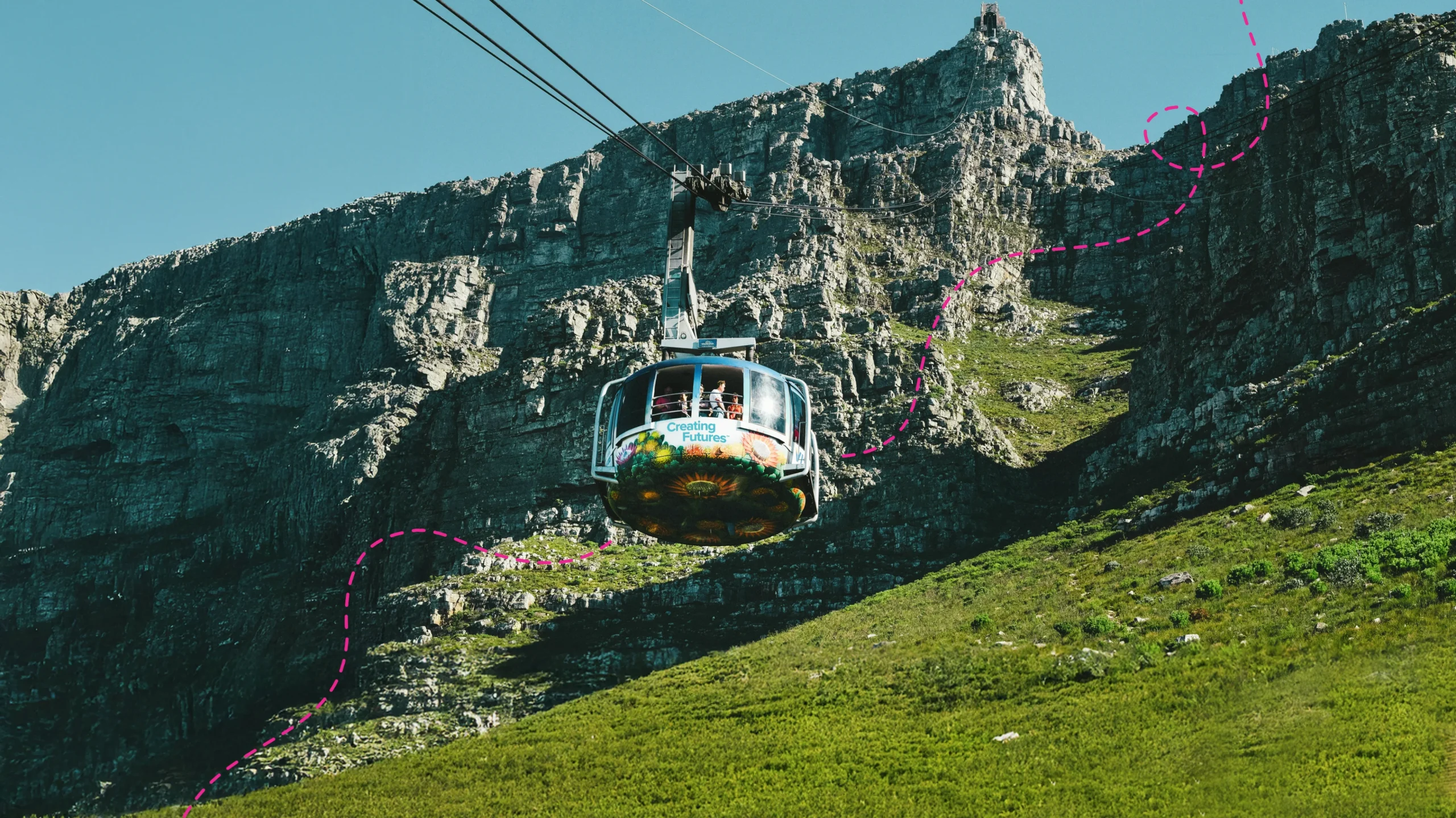 Cape Town's Table Mountain Cable Car midway with the words "Creating Futures" on it.
