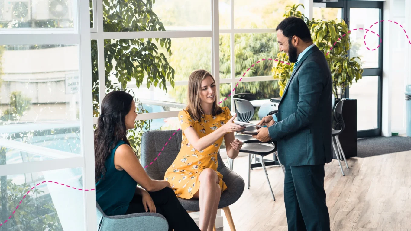 Three people working together in an office