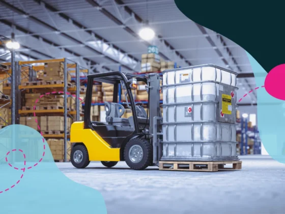 Forklift transporting heavy object in a factory.