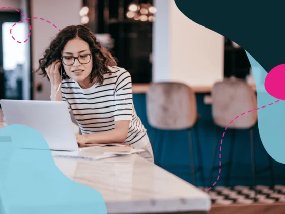 Woman on a call on her laptop in a office.