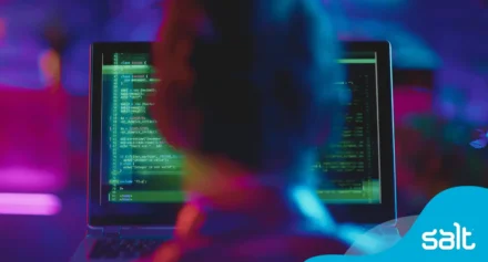 Cybersecurity professional looking at computer screen.