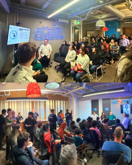 A group of people sitting and standing in the Salt Auckland offices at a "Ministry of Testing" meet-up hosted by Salt.