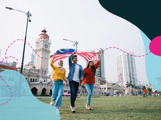 Malaysians waving a big flag together