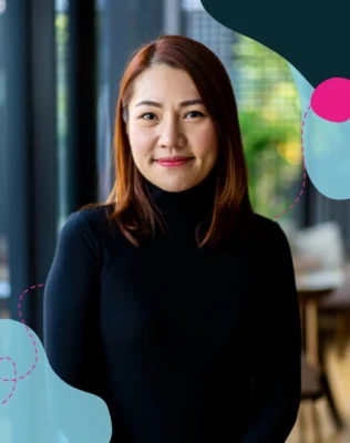 Headshot of a woman wearing black turtle neck