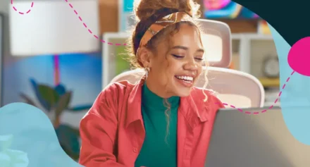 Women smiling at laptop