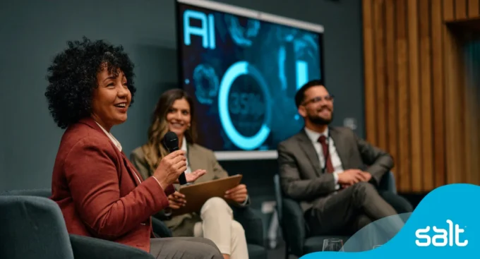A group of leaders on a panel discussing AI.