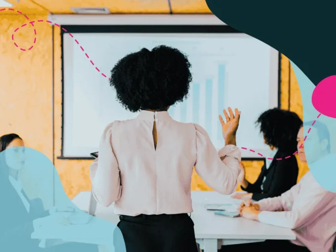 Women presenting to a boardroom