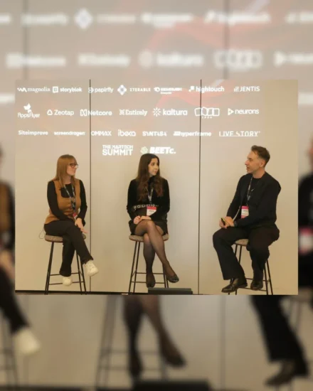 Three panelists, including Salt's Global Head of Marketing, Jenny Wood, seated on stools during a panel discussion at the MarTech Summit, with event sponsor logos projected behind them.