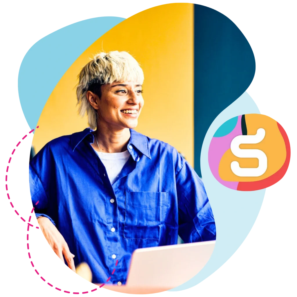 Essential AI talent report 5 Person at work smiling with laptop.