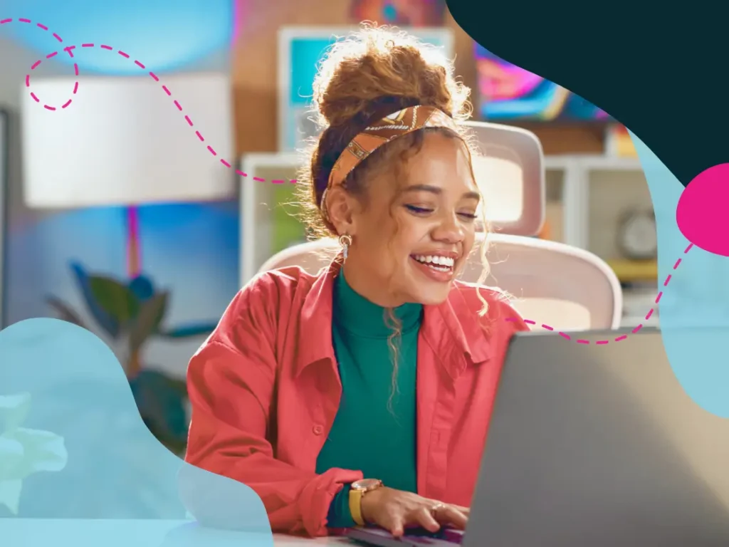 Essential AI talent report 5 Women smiling at laptop