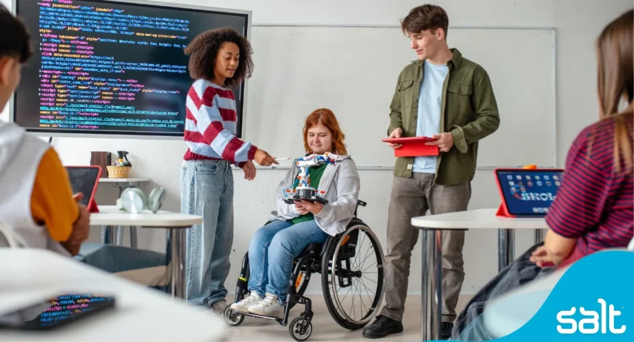 A group of young students looking at tech