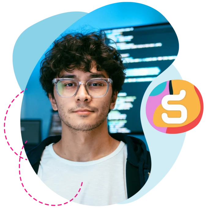 A tech professional looking forward with screens behind them