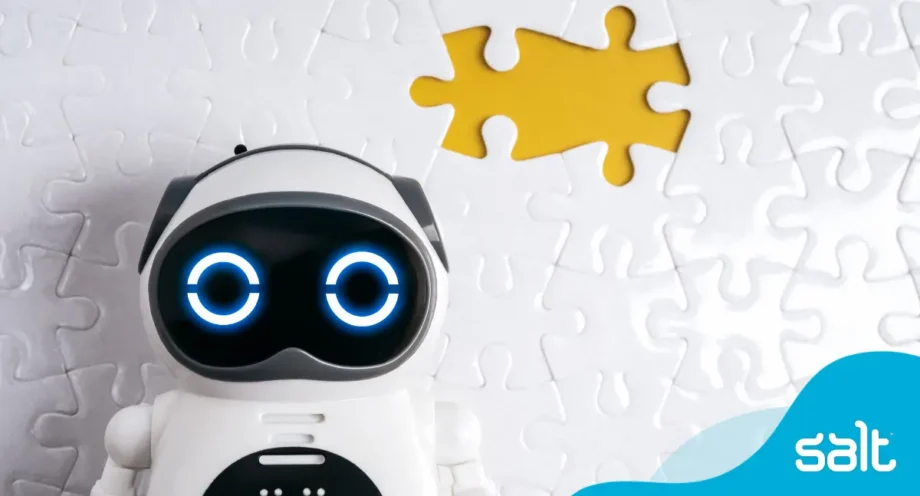 Robot looking at screen with a missing jiggsaw piece behind it.