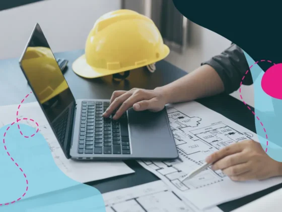 Person on laptop with yellow hardhat on table