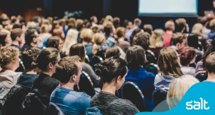 crowd of professionals seated at an event